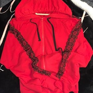 red zip up with lace lining on sleeves